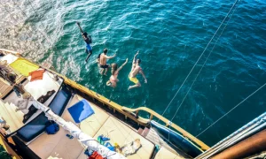 aerial view of happy millenial friends jumping fro 2024 07 03 02 44 03 utc.webp