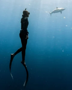 vertical shot of a female diving near a shark 2023 11 27 05 33 08 utc 1.webp