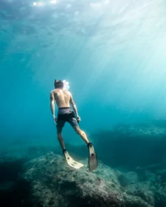 vertical shot of a male swimming under water durin 2023 11 27 05 34 33 utc 1.webp